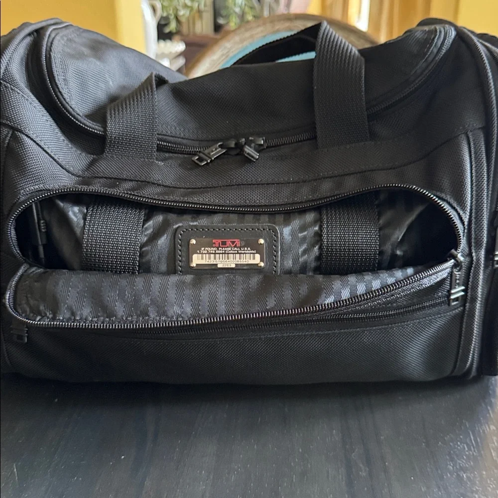 Tumi Black Men's Duffel with Red Logo Luggage Tag